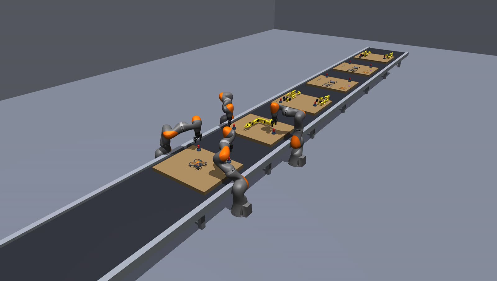 Factory line with four arms assembling a drone and a robot arm